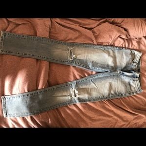 Neon blonde jeans with tears on knees. Size 26